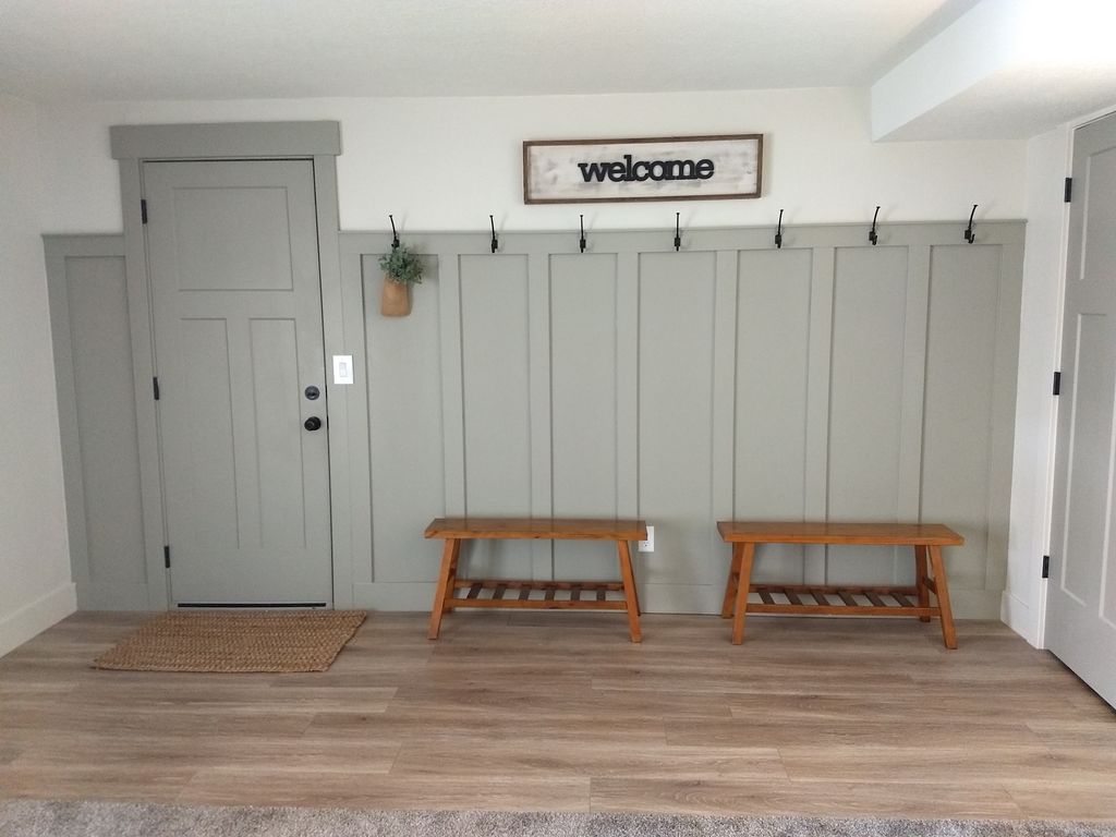 Decorative wall with coat hooks next to and outsid