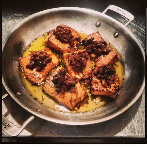 seared salmon topped with olive tapenade