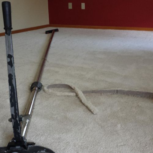 carpet stretching with a power stretcher