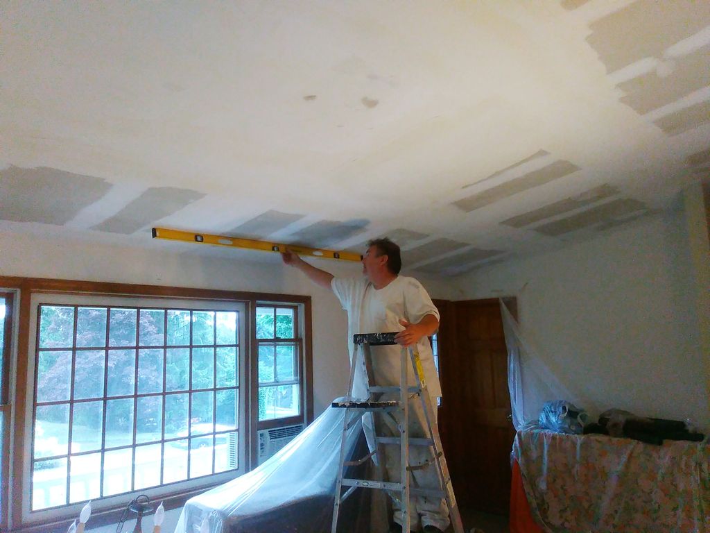 Popcorn ceiling removed, skim coat applied.