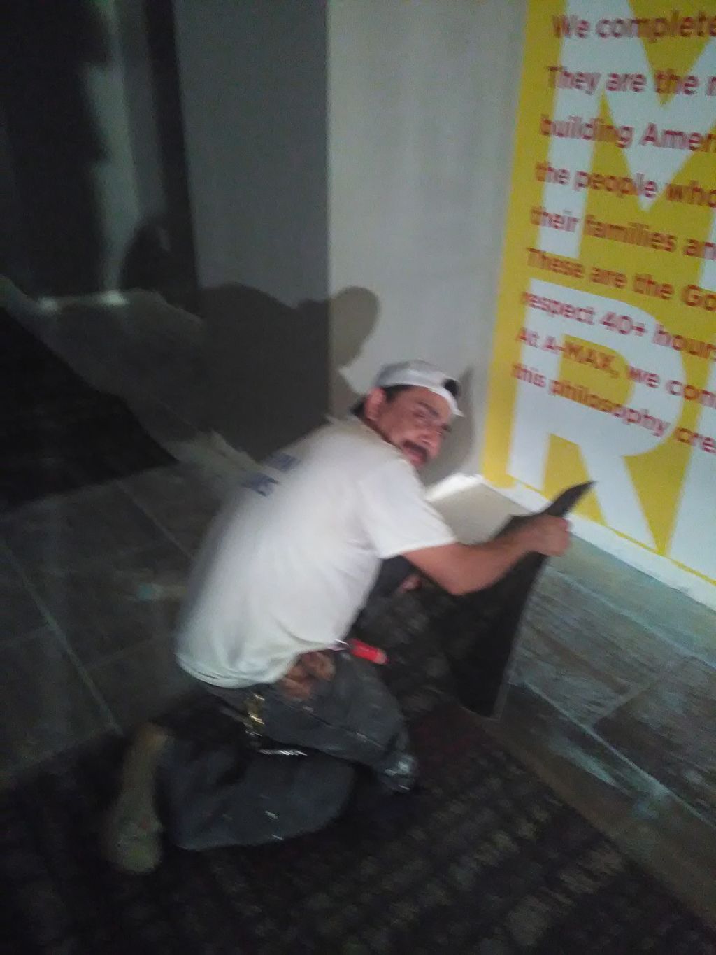 Placing carpet at Pharr, TX. Amaxx Insurance 