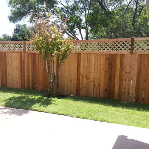 New cedar fence with decorative top.