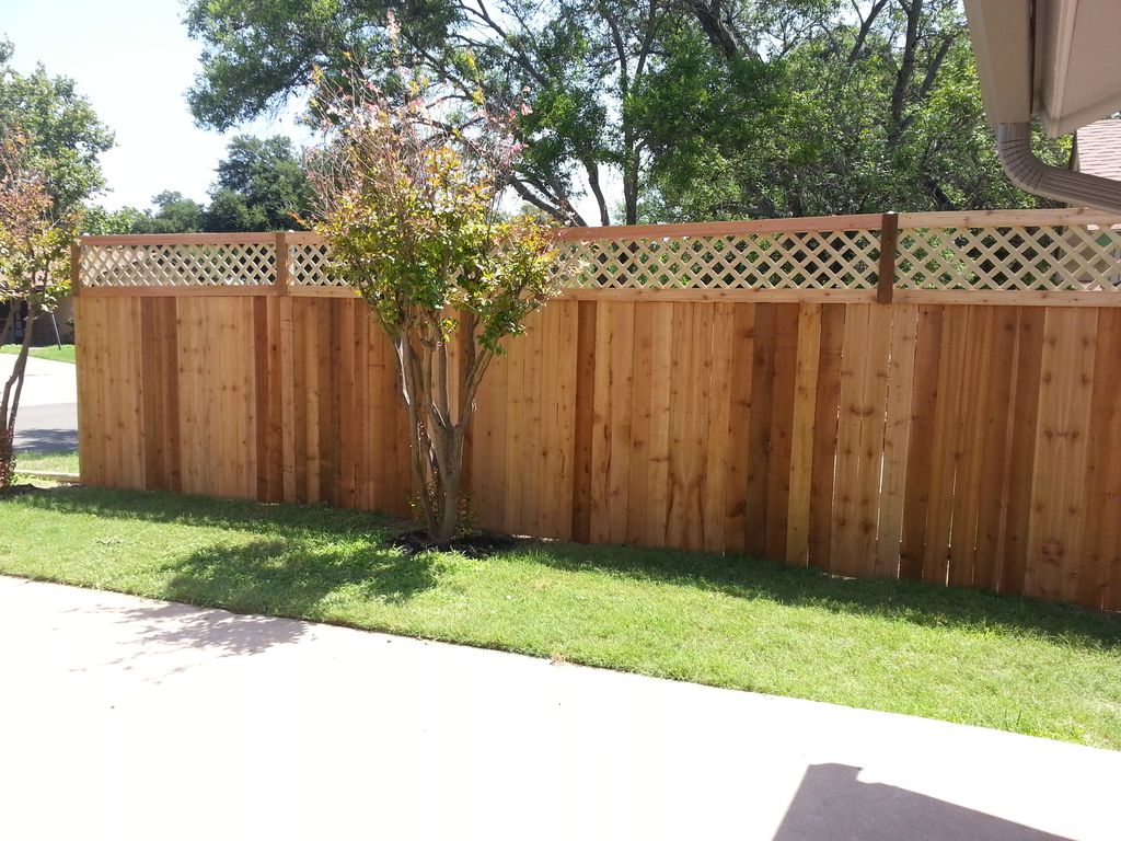 New cedar fence with decorative top.
