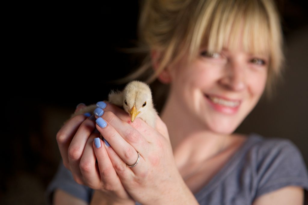 Portrait of a woman who loves her new chick.