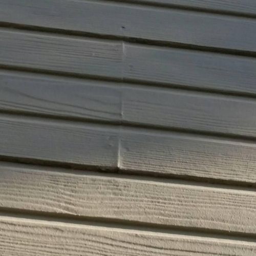 Exterior siding has swollen from moisture being ab