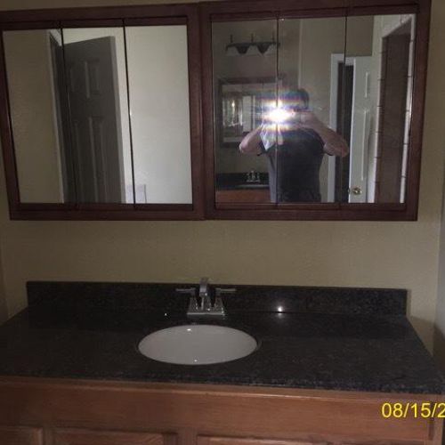After bathroom flood new vanity and mirror