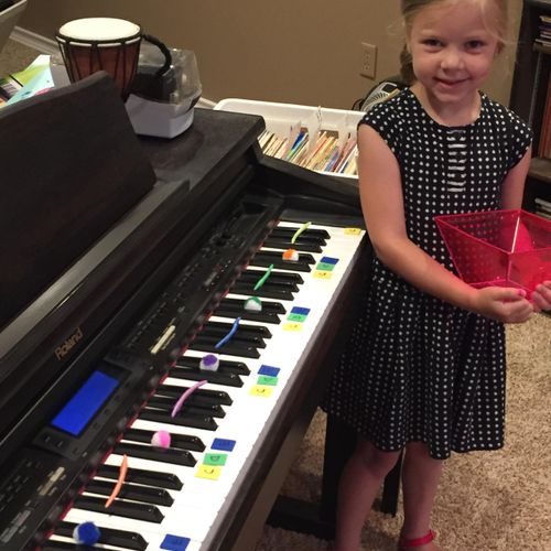 Young beginner "decorating" the piano