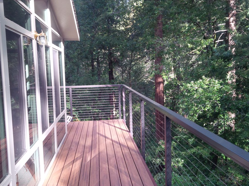 Trex decking with concealed fasteners and metal ra