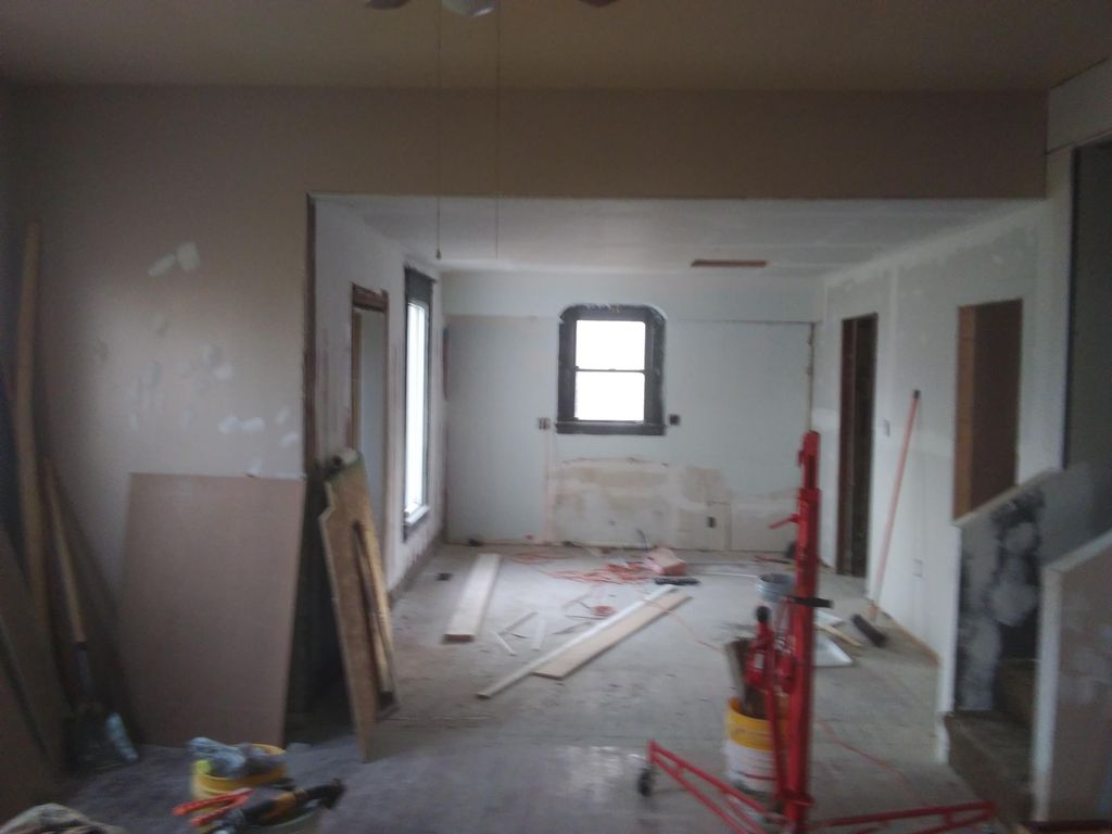 During. Opened up kitchen area and replaced ceilin