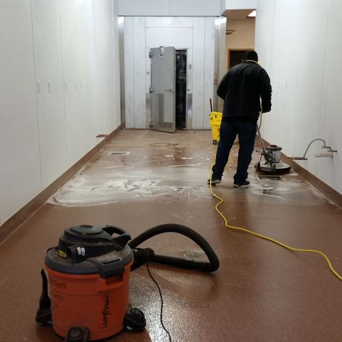 Scrubbing Floor, post construction cleaning of Res