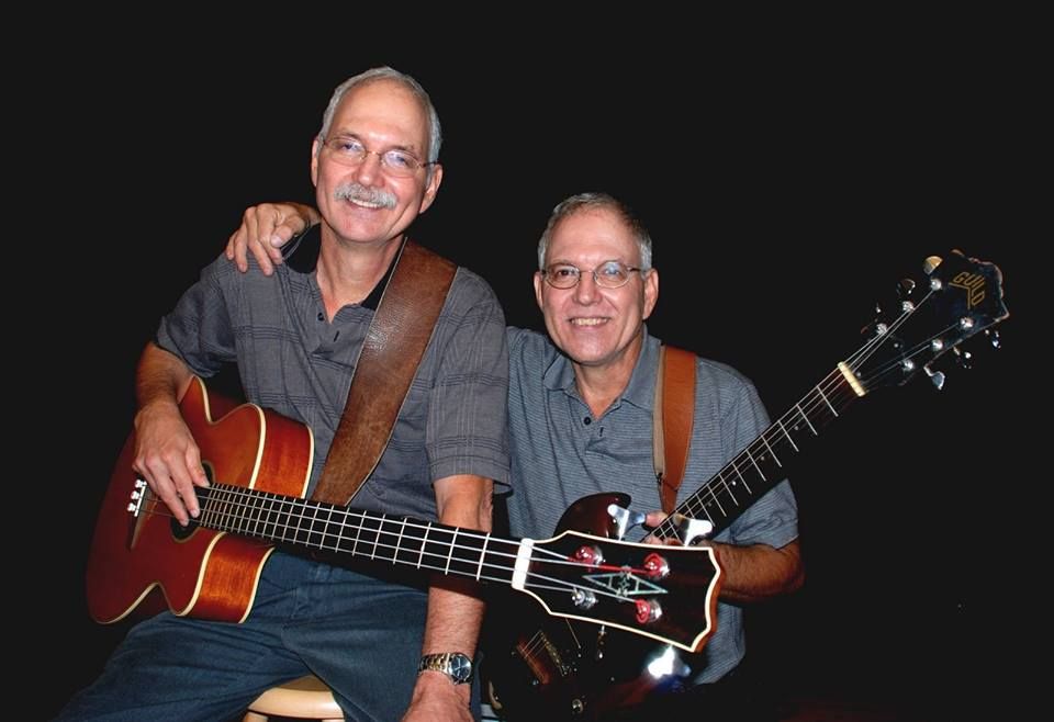 I'm the twin leaning down with the Guild guitar. I