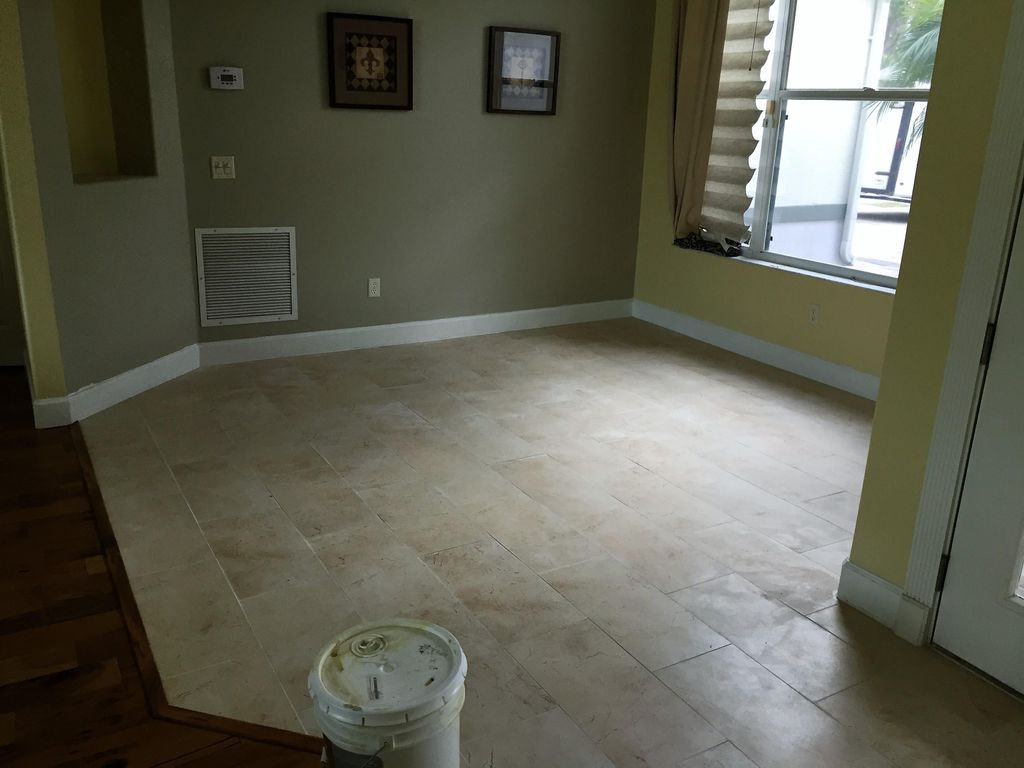REMOVED GLUE DOWN WOOD FLOORING AND INSTALLED 1' X
