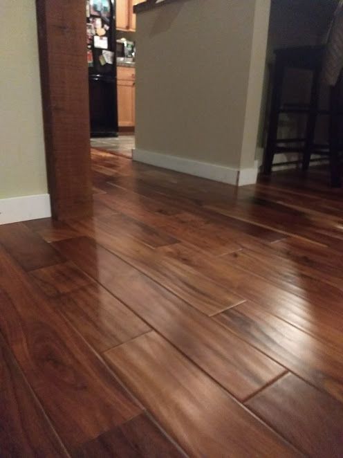 Installed beautiful, new hand-scraped wood floorin