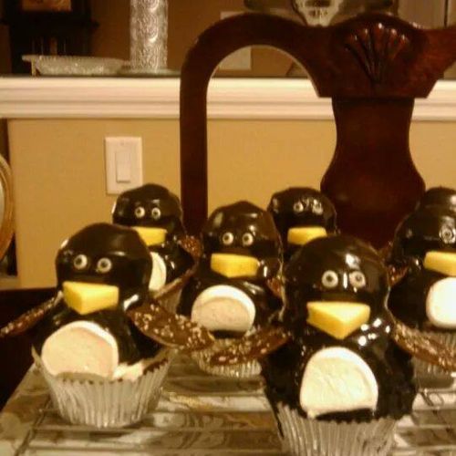 Winter wonderland birthday with penguin cupcakes.