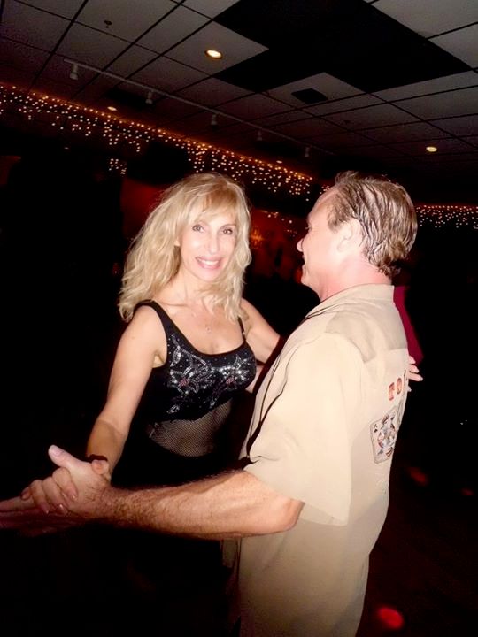 Dancing with a student.
