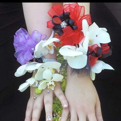 various fresh orchid corsages with crystal accents