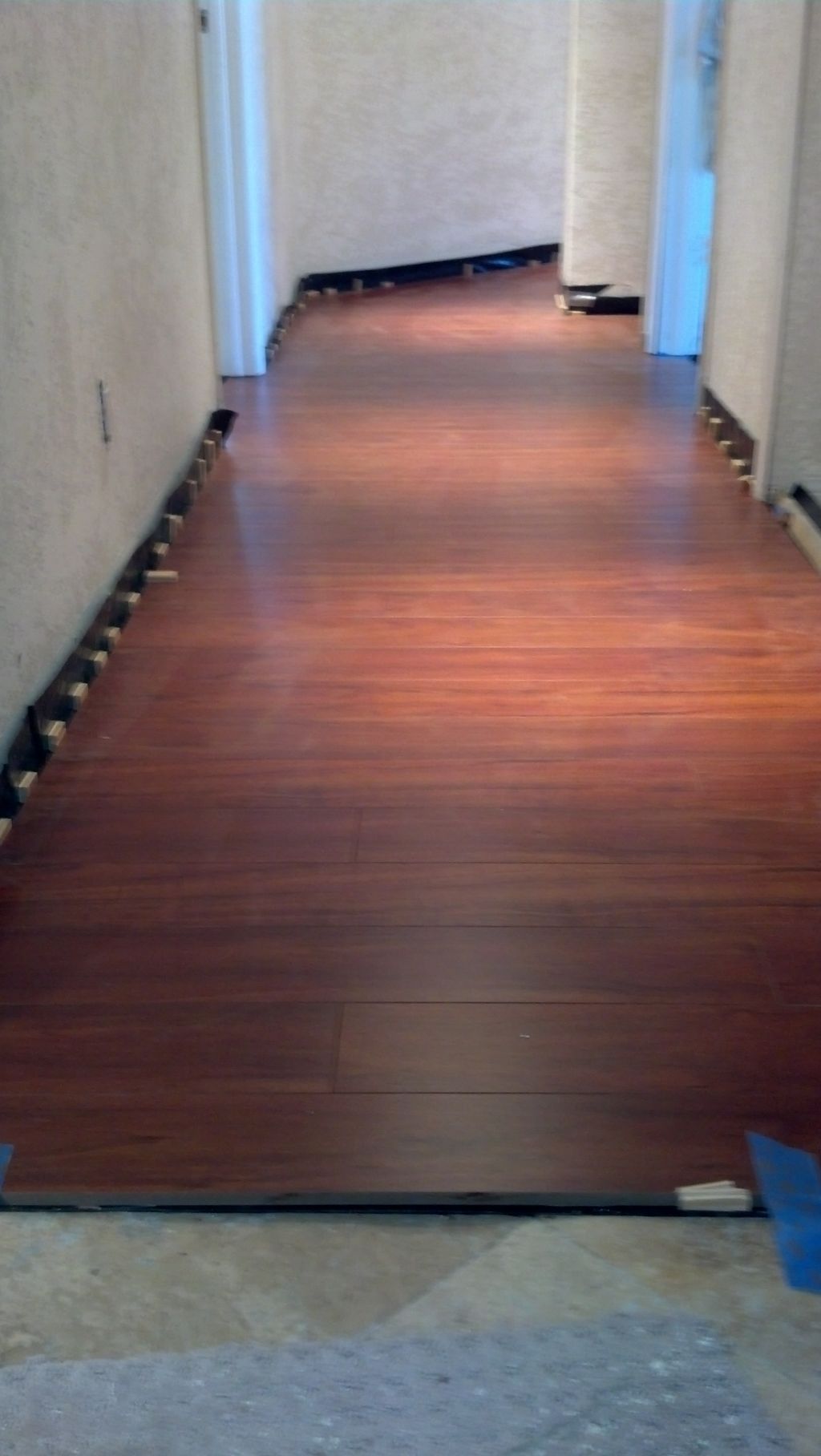 laminate flooring through hallway, 6mil plastic ov