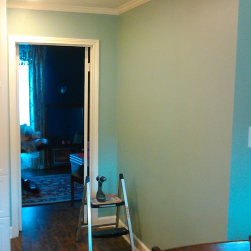 installed  crown molding, trim, floor and painted 