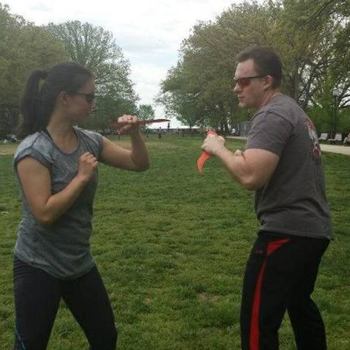 Student, Christine, practicing knife defense and t