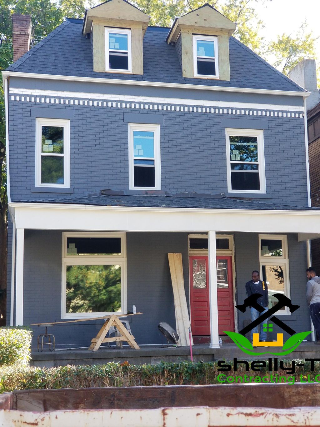 exterior painting, porch posts installed, gutters,