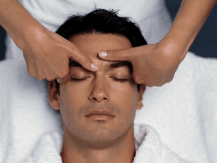 Facial massage with essential oils .