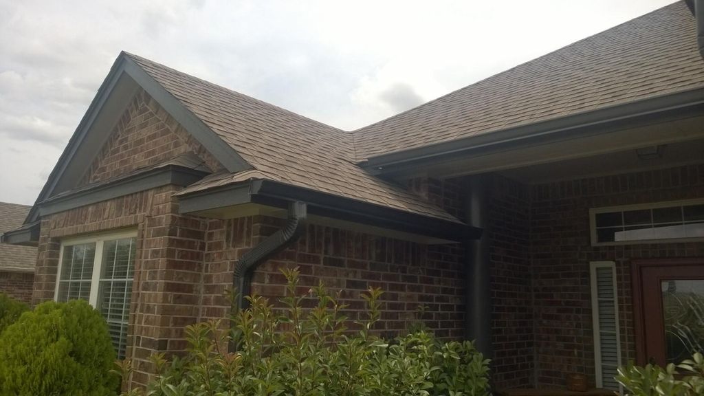 Overlapping eaves with downspout