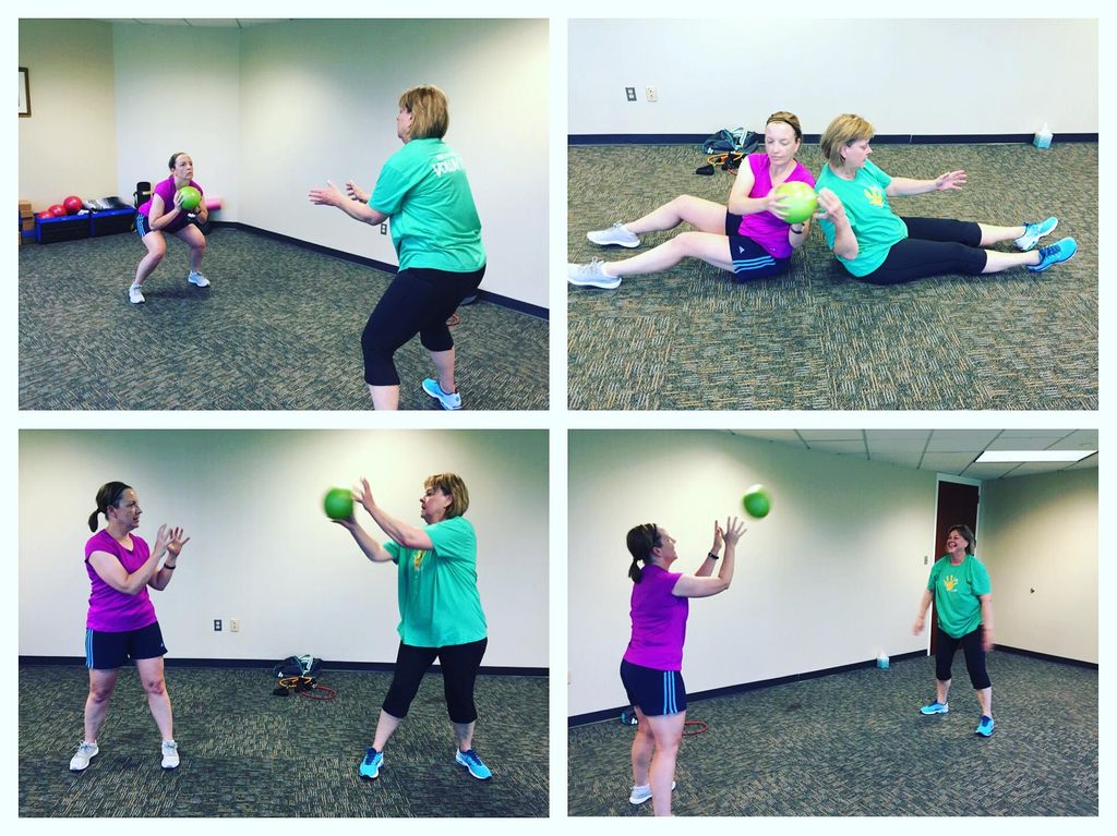 Coworkers staying getting fit in the office during