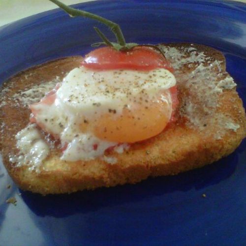Compari tomato with perfectly poached egg on home 