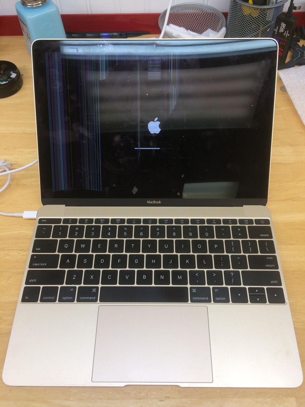 Apple MacBook with a broken LCD panel in for repai