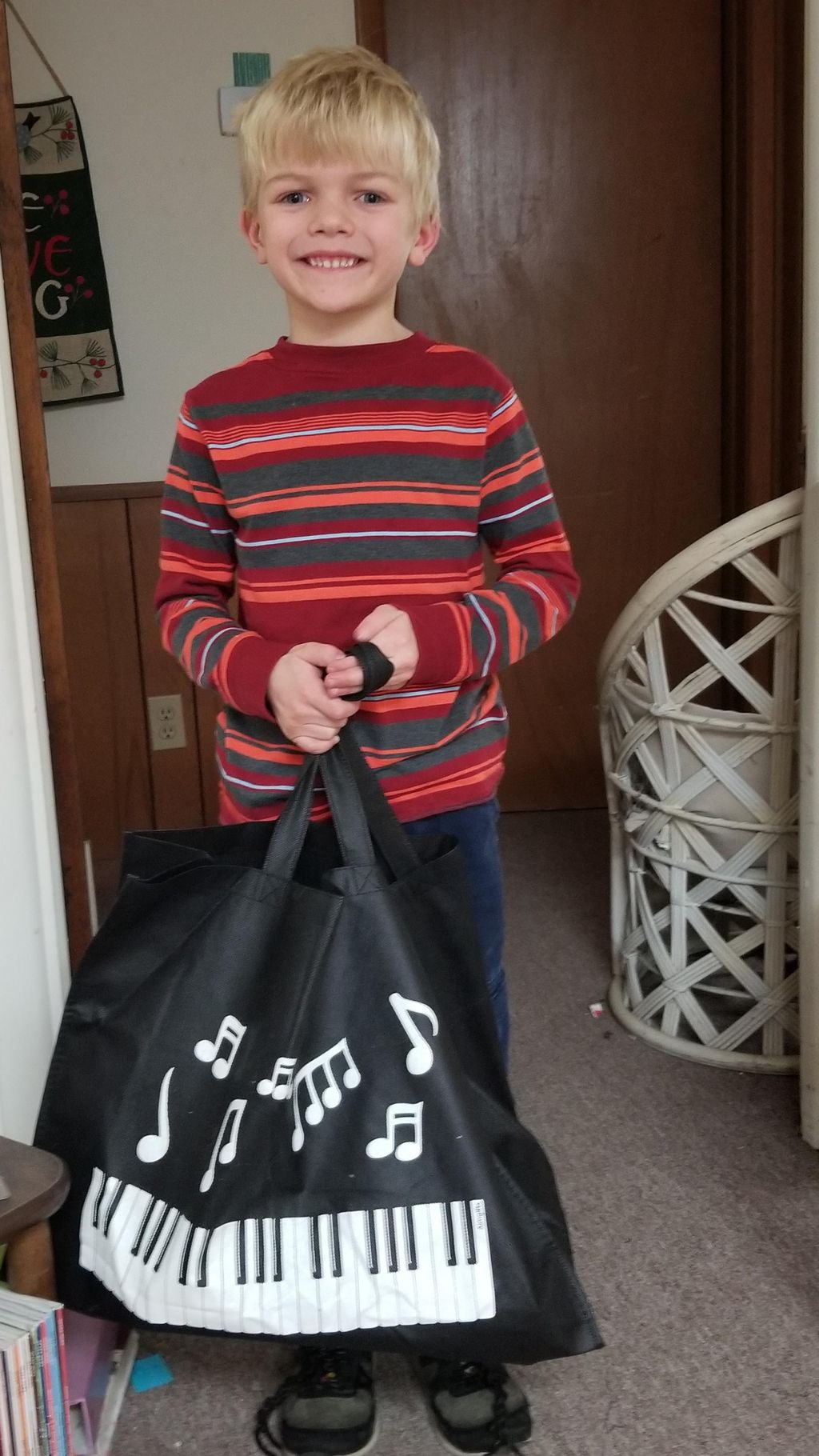 A happy piano student earned a music bag for learn