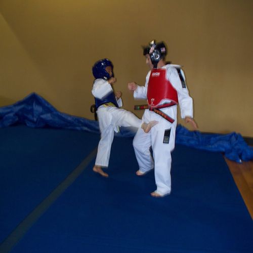 Taekwondo Sparring w/ Yellow Tip Student