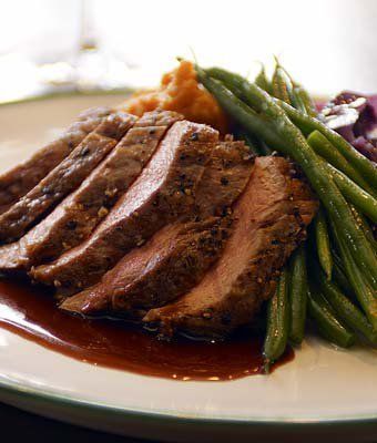 Sliced Beef tenderloin  with green beans and Roast