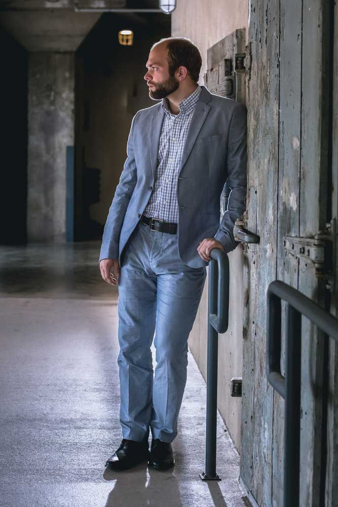 Backlit portrait of a young professional.