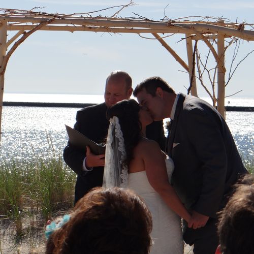 Matt performs a wedding on the beach of Lake Michi