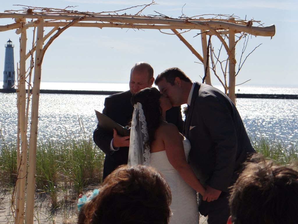 Matt performs a wedding on the beach of Lake Michi