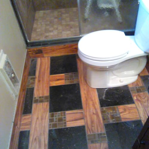 custom granite tile, bordered by wood tile (gettin