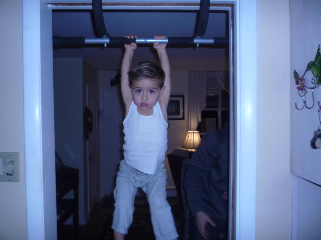 My youngest client on the pull up bar! Actually th