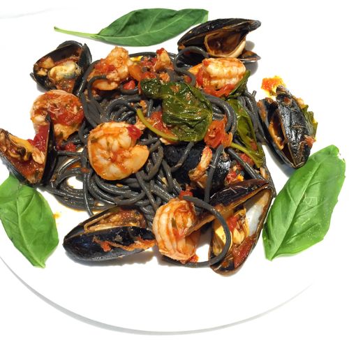 Squid Ink Pasta with shrimp, mussels , and crab. A