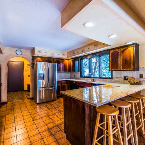 Kitchen renovation including granite counter tops,