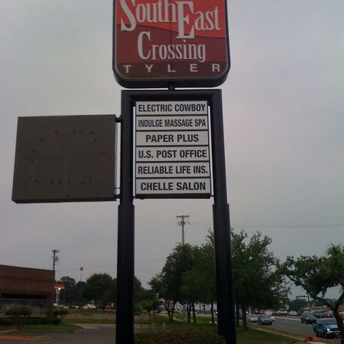 shopping center sign with tenant sign