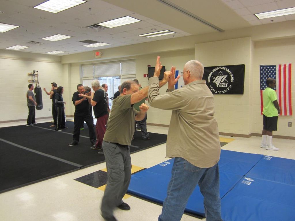 Working with a student on blocks from a punch.