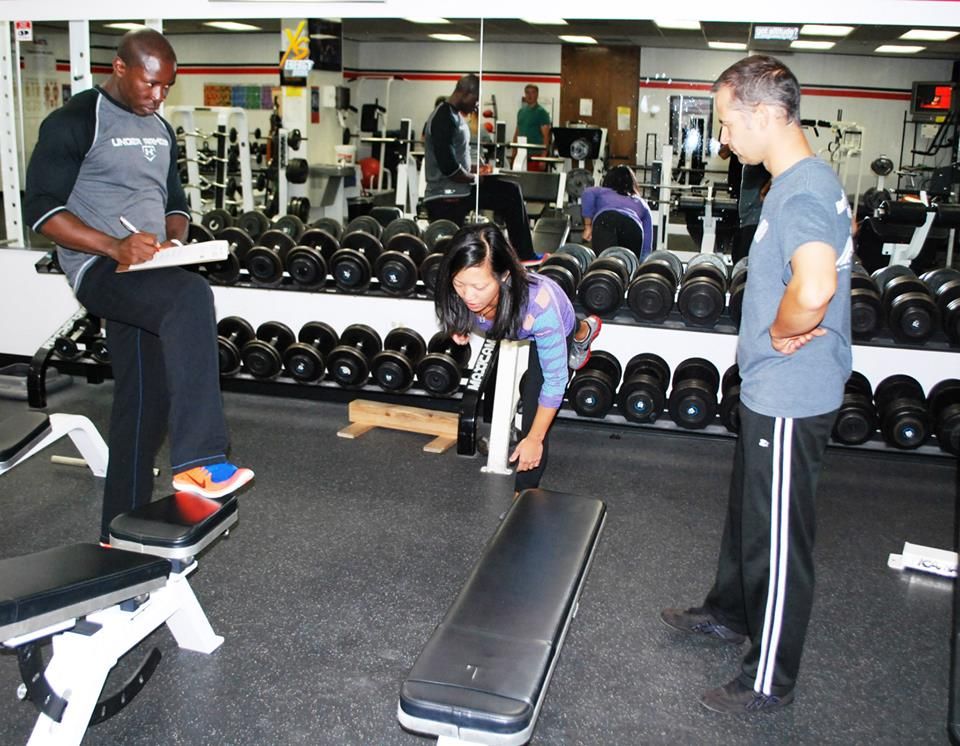 Demonstrating a progression of a low row exercise.