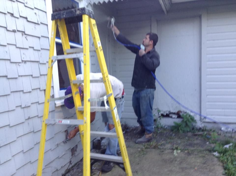 Painting a home in the historical district in Auro