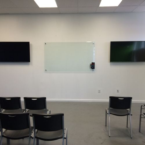 This installation has 2 50" TVS connect to a PC fo