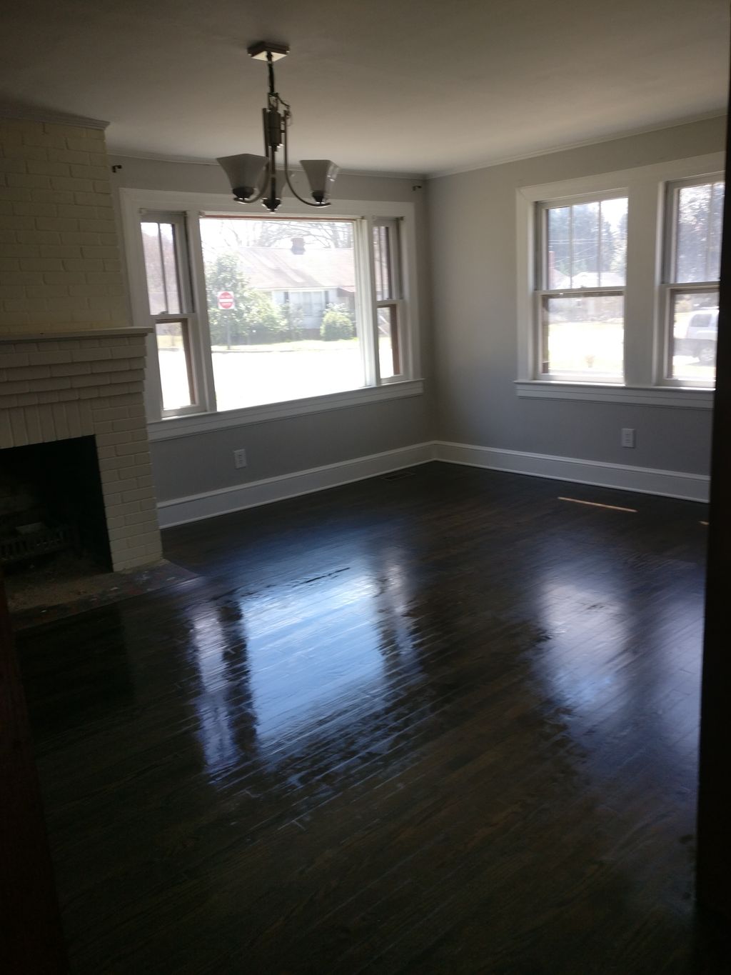 badly damaged hardwood flooring. it was shining br