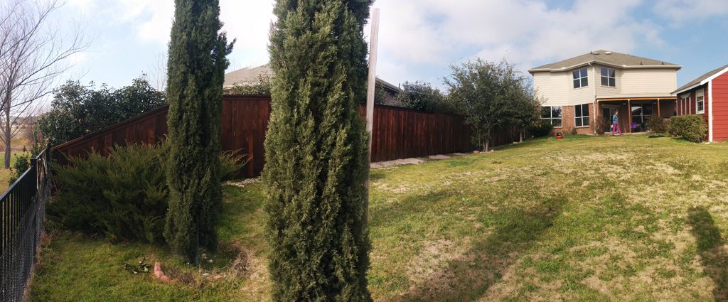 Prestained residential wood fence with cap & trim 