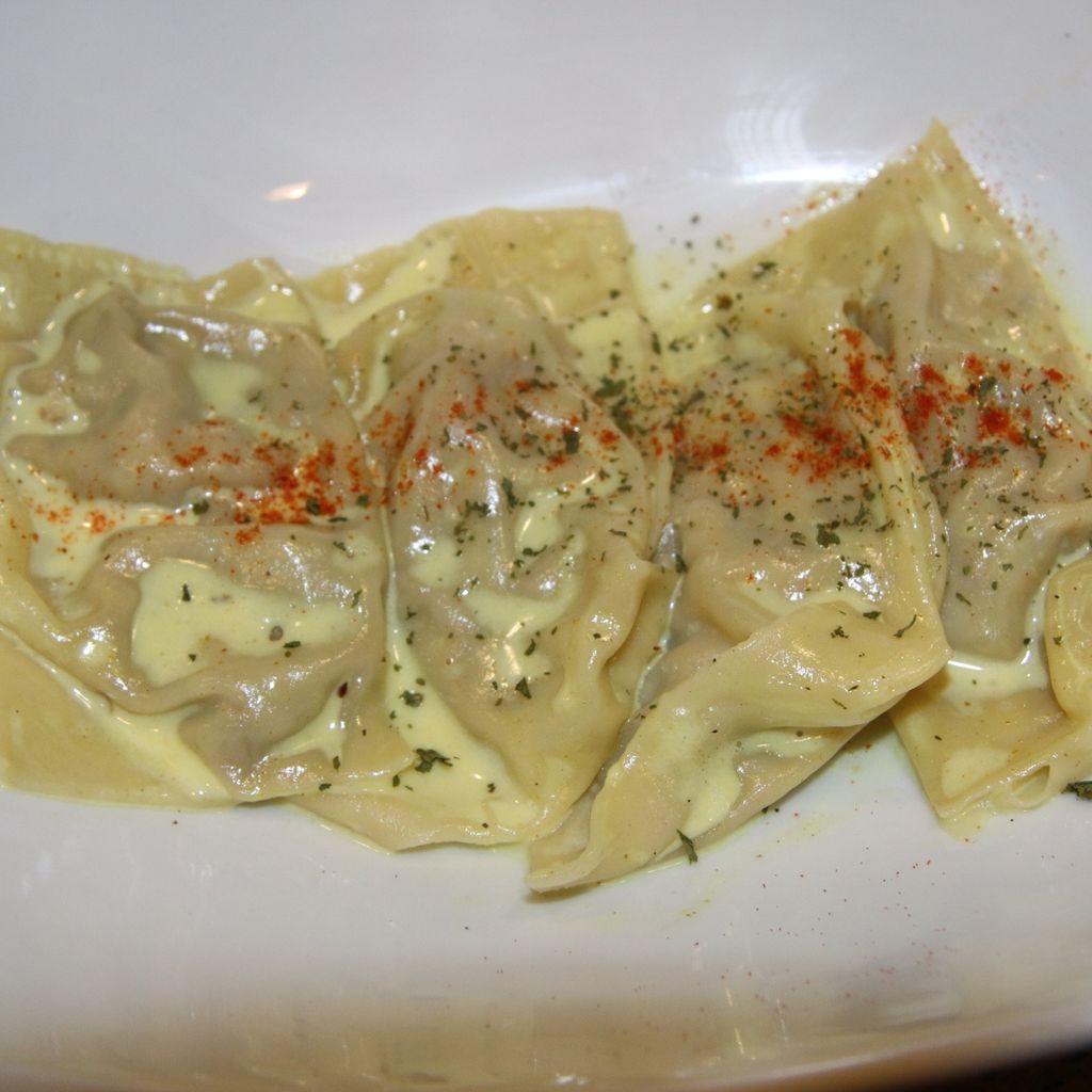 Curry chicken ravioli in  a sweet coconut cream sa