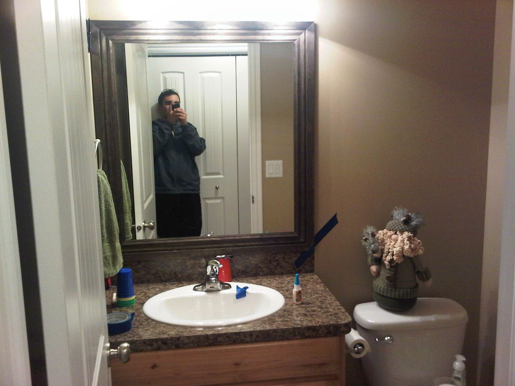 Stained and framed bathroom mirrors on this home.