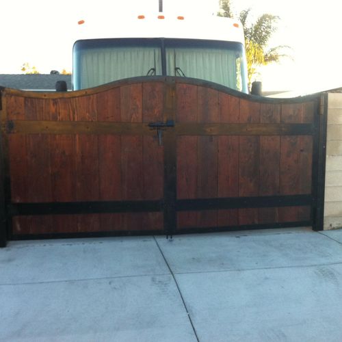 Antique redwood gate with iron frame.