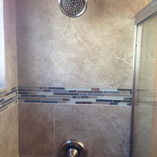 Remove existing bathtub and create walk in shower.